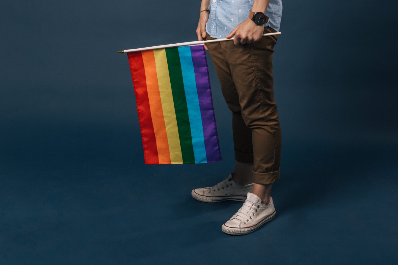 Rainbow flag being held