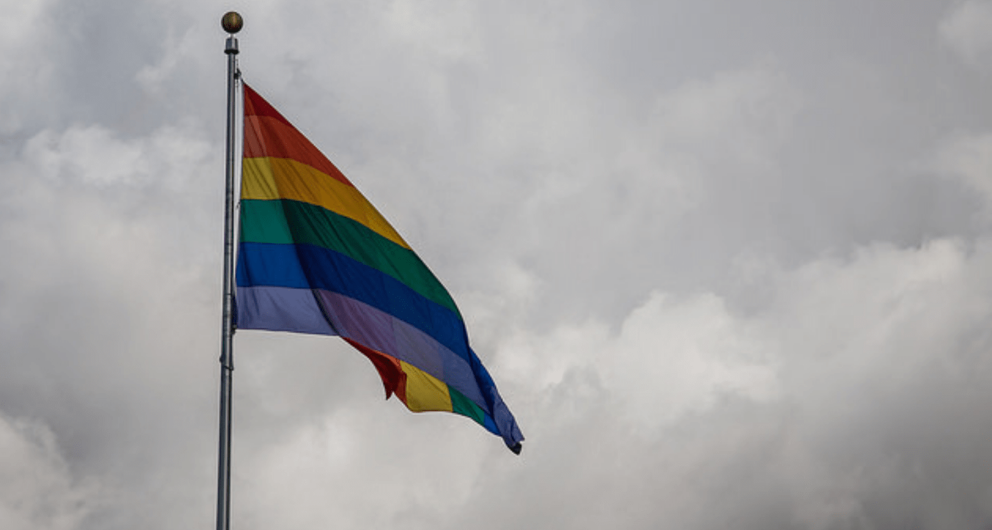 Gay Pride Flag on Gray Sky